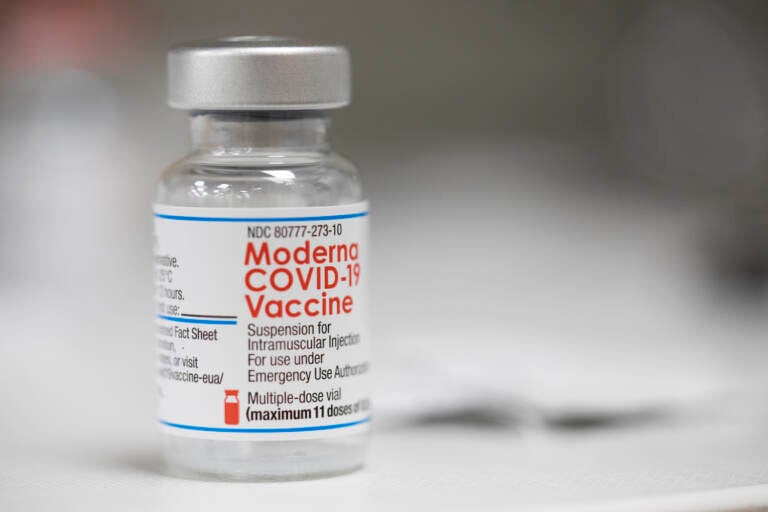 A vial of the Moderna COVID-19 vaccine is displayed on a counter at a pharmacy in Portland, Ore., Monday, Dec. 27, 2021. U.S. regulators have granted full approval to Moderna’s COVID-19 vaccine after reviewing additional data on its safety and effectiveness. The decision Monday, Jan. 31, 2022 by the Food and Drug Administration comes after many tens of millions of Americans have already received the shot under its original emergency authorization. Full approval means FDA has completed the same rigorous, time-consuming review for Moderna’s shot as dozens of other long-established vaccines. (AP Photo/Jenny Kane)