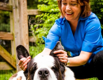 Penny Ellison with her former dog, Shaq. Penny had led Hand2Paw for more than a decade. Photo provided.