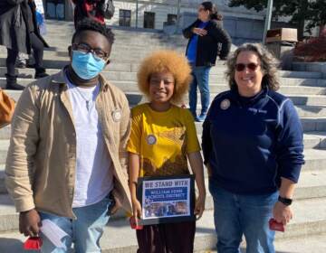 (From left) Paul Vandy and Trinity Giddings  stand alongside William Penn school board member Jennifer Hoff in Harrisburg on Nov. 12. (Courtesy of Tomea Sippio-Smith)