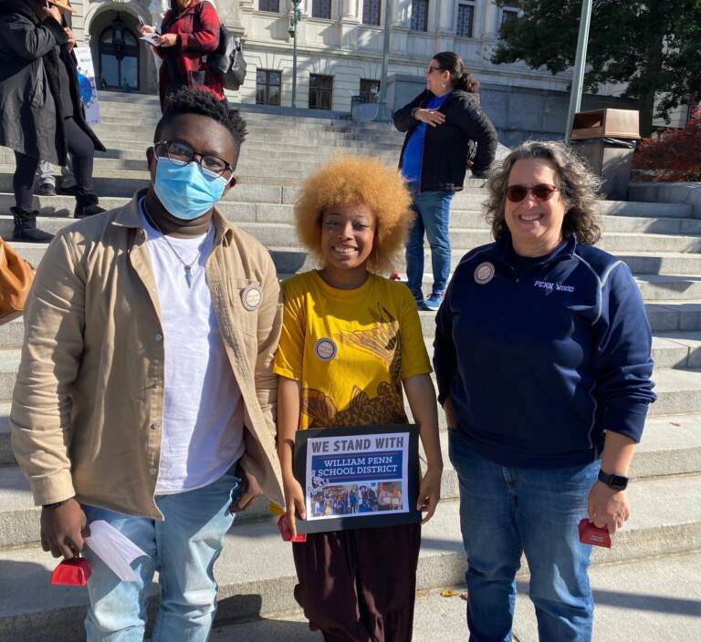 (From left) Paul Vandy and Trinity Giddings  stand alongside William Penn school board member Jennifer Hoff in Harrisburg on Nov. 12. (Courtesy of Tomea Sippio-Smith)