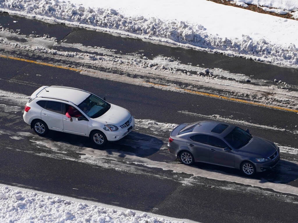 Stranded motorists wait for a tow on I-95