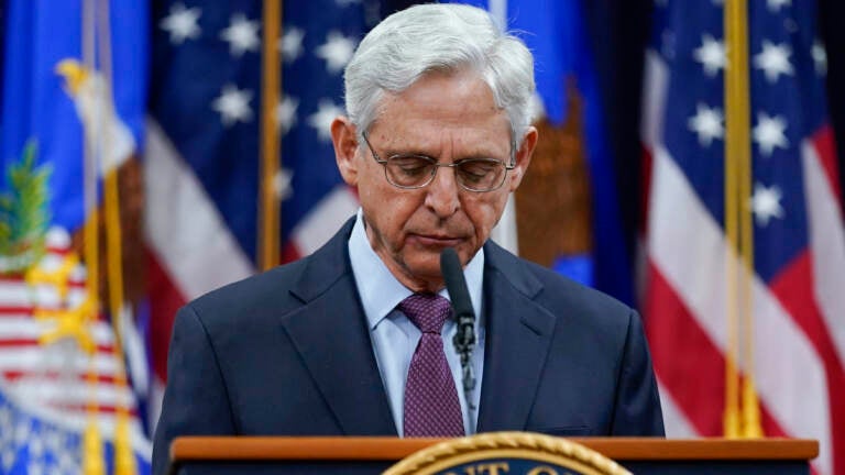 Attorney General Merrick Garland pauses as he speaks at the Department of Justice in Washington on Wednesday, in advance of the one year anniversary of the attack on the U.S. Capitol. (Carolyn Kaster/AP)