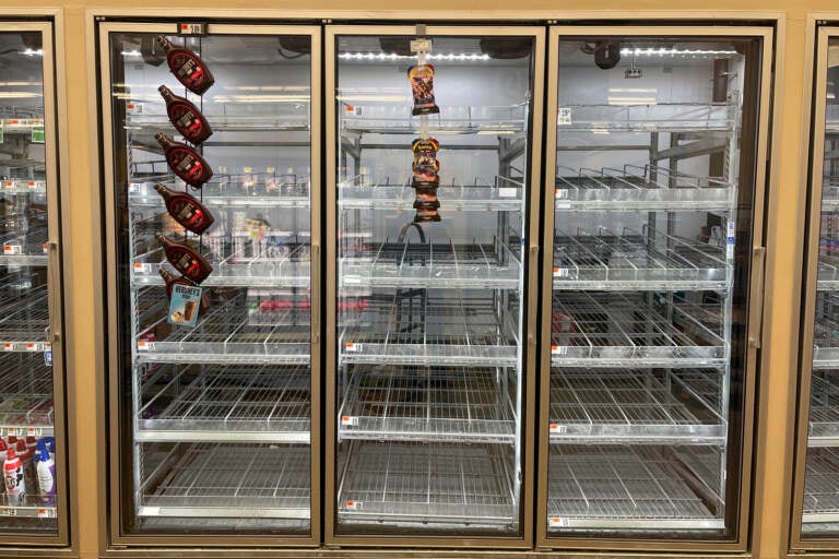 The milk shelf is mostly empty at a Giant grocery store on Tuesday in Washington, D.C. (Parker Purifoy/AP)