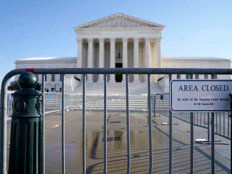 The Supreme Court shown Friday, Jan. 7, 2022, in Washington. The Supreme Court is taking up two major Biden administration efforts to bump up the nation's vaccination rate against COVID-19 at a time of spiking coronavirus cases because of the omicron variant