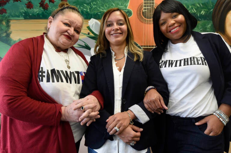 (Left to right) Camden City Councilmembers Marilyn Torres, Felisha Reyes-Morton, and Shaneka Boucher link arms