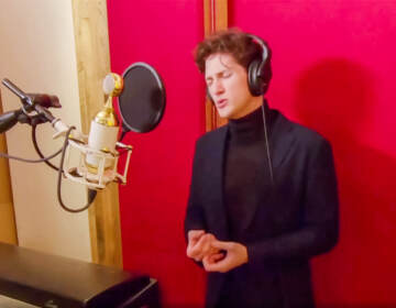 Colin Aikins singing in a studio