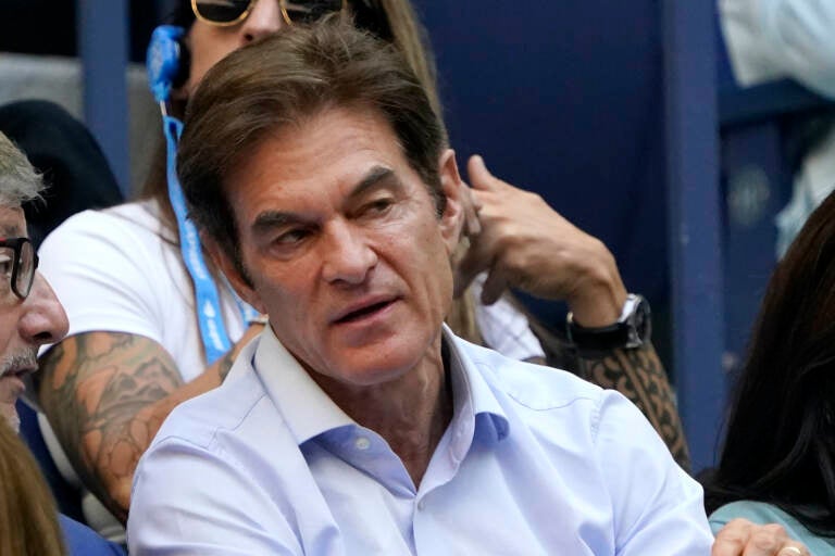 Dr. Mehmet Oz watches play during the women's singles final of the US Open tennis championships