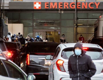 People and cars line up outside of Boston Medical Center