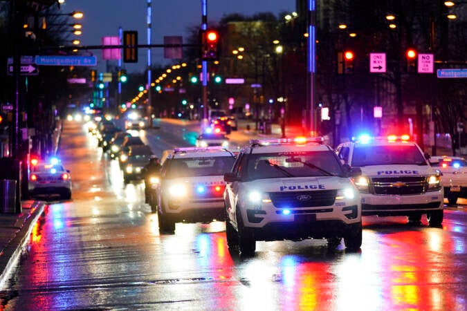 A funeral procession arrives at Temple's Liacouras Center