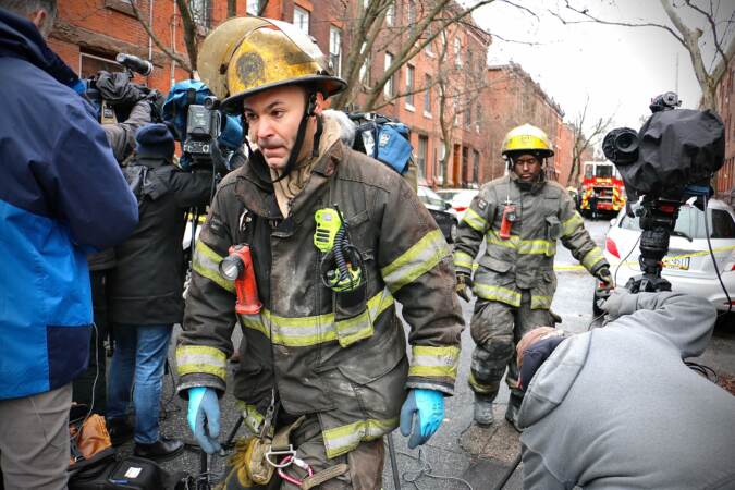 Firefighters leave the scene of a fire