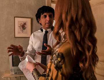 M. Night Shyamalan talking to actress Lauren Ambrose on the set of Servant