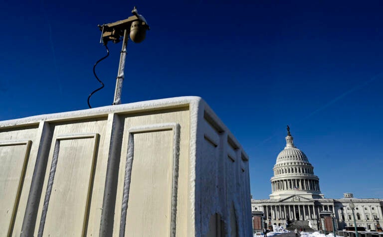 Newly installed surveillance cameras are positioned near the U.S. Capitol