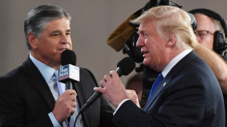 Fox News Channel and radio talk show host Sean Hannity (left) interviews U.S. President Donald Trump before a campaign rally at the Las Vegas Convention Center on September 20, 2018 in Las Vegas, Nevada.   (Photo by Ethan Miller/Getty Images)