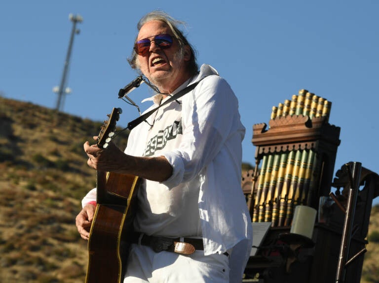 Neil Young, performing in Lake Hughes, Calif. in 2019.
(Kevin Winter/Getty Images)