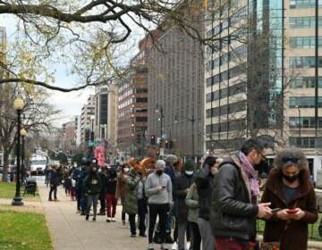 People line up to get tested for COVID-19 at a testing site in Washington, DC