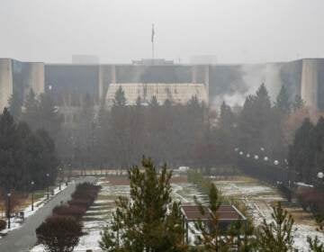 This general view shows a burnt-out administrative building in central Almaty on January 7, 2022, after violence that erupted following protests over hikes in fuel prices. - Kazakhstan's president has rejected calls for talks with protesters after days of unprecedented unrest, vowing to destroy 