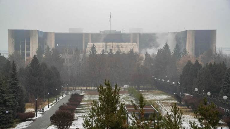 This general view shows a burnt-out administrative building in central Almaty on January 7, 2022, after violence that erupted following protests over hikes in fuel prices. - Kazakhstan's president has rejected calls for talks with protesters after days of unprecedented unrest, vowing to destroy 