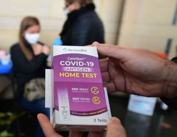A rapid Covid-19 test kit is displayed after being given out for free to people receiving their Covid-19 vaccines or boosters at Union Station in Los Angeles, California, on January 7, 2022. - Los Angeles County reported more than 37,000 new coronavirus cases on January 6, breaking records again as a regional surge of the Omicron variant continues. (Photo by Frederic J. BROWN / AFP) (Photo by FREDERIC J. BROWN/AFP via Getty Images)