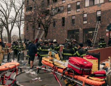 NEW YORK, NY - JANUARY 09: Emergency first responders remain at the scene of an intense fire at a 19-story residential building that erupted in the morning on January 9, 2022 in the Bronx borough of New York City. Reports indicate over 50 people were injured. (Photo by Scott Heins/Getty Images)