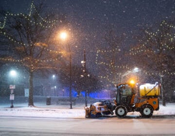 GREENVILLE, SC - JANUARY 16: A snow plow clears Main St. on January 16, 2022 in Greenville, South Carolina. Snow, sleet and freezing rain are expected in the area for the remainder of the day. (Photo by Sean Rayford/Getty Images)