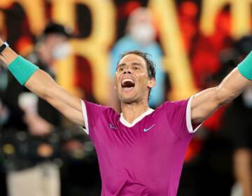 Spain's Rafael Nadal celebrates after winning the men's singles final match against Russia's Daniil Medvedev on day fourteen of the Australian Open tennis tournament in Melbourne on January 31, 2022. - -- IMAGE RESTRICTED TO EDITORIAL USE - STRICTLY NO COMMERCIAL USE -- (Photo by Martin KEEP / AFP) / -- IMAGE RESTRICTED TO EDITORIAL USE - STRICTLY NO COMMERCIAL USE -- (Photo by MARTIN KEEP/AFP via Getty Images)