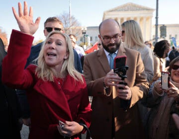 WASHINGTON, DC - DECEMBER 01: Rep. Marjorie Taylor Greene (R-GA) joins fellow anti-abortion activists in front of the U.S. Supreme Court as the justices hear hear arguments in Dobbs v. Jackson Women's Health, a case about a Mississippi law that bans most abortions after 15 weeks,  on December 01, 2021 in Washington, DC. With the addition of conservative justices to the court by former President Donald Trump, experts believe this could be the most important abortion case in decades and could undermine or overturn Roe v. Wade. (Photo by Chip Somodevilla/Getty Images)