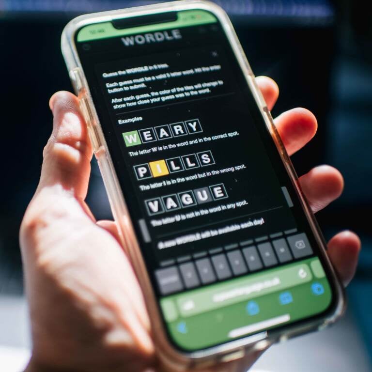 The New York Times has purchased the online word game Wordle has that took off last fall, with people posting their daily scores. (Brandon Bell/Getty Images)