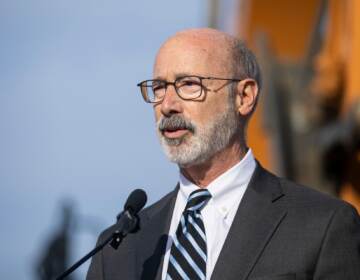 Gov. Tom Wolf speaks from a podium