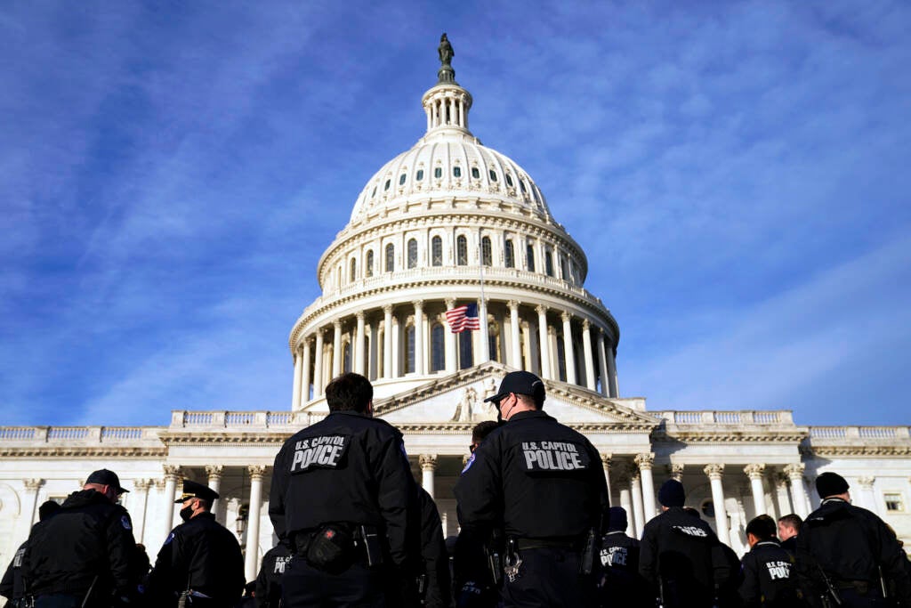 A large group of police arrive at the Capitol