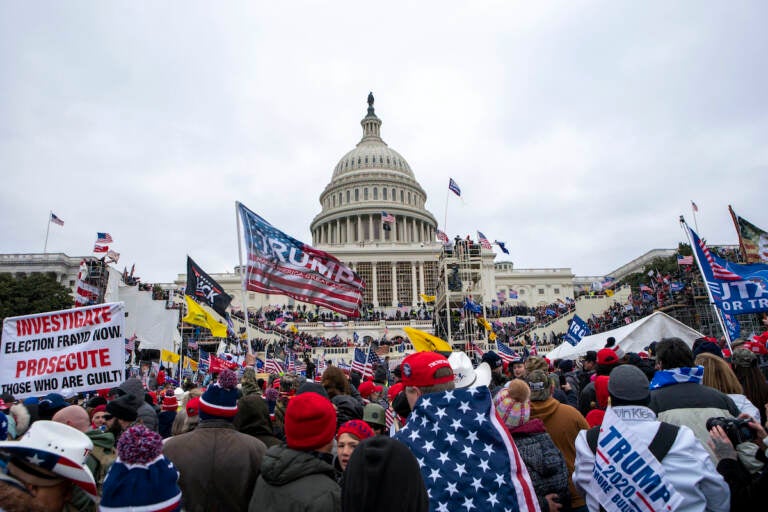 File photo: Rioters loyal to President Donald Trump rally at the U.S. Capitol in Washington on Jan. 6, 2021. (AP Photo/Jose Luis Magana, File)