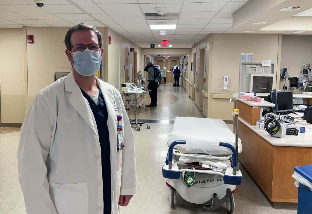 Justin Bartels stands inside a hospital