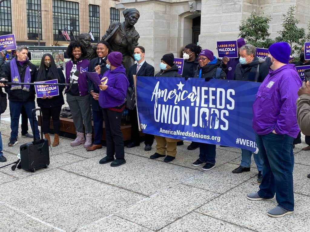 Rep. Malcolm Kenyatta stands with members of SEIU outside City Hall