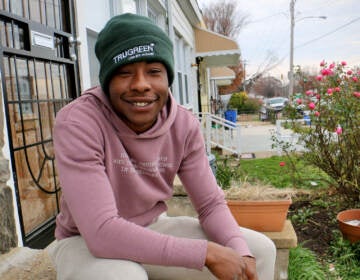 Asyod Boyd sits on his stoop