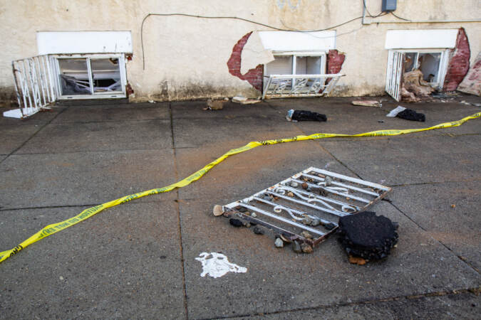 The Philadelphia Fire Department rescued a resident out of a basement window at a home at the corner of 56th and Springfield after an early water morning water main break on Feb. 9, 2022. (Kimberly Paynter/WHYY)