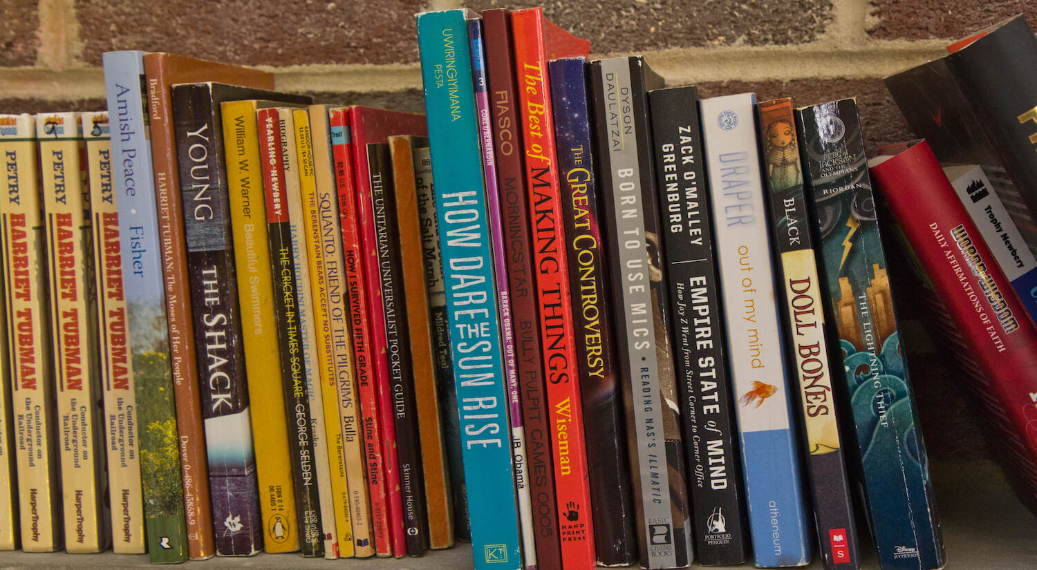 A sampling of books available for kids to read at The Teen Safe Space in Philadelphia. (Kimberly Paynter/WHYY)