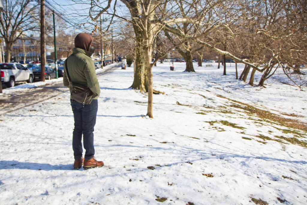 Kermit O stands in Clark Park in the snow