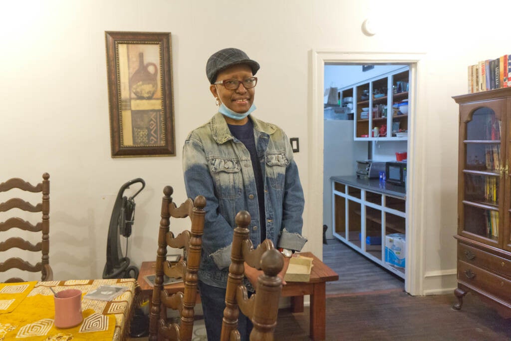 Asantewaa Nkrumah-Ture stands inside a dining room