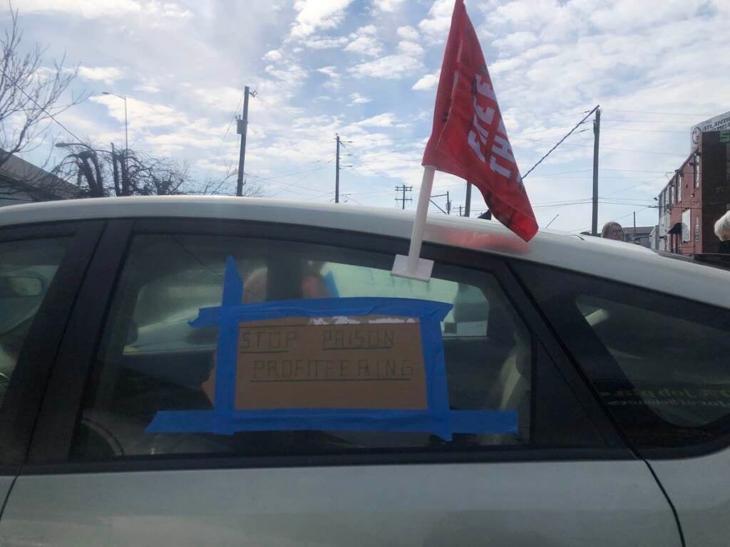 A sign taped onto one of the cars protesting the conditions inside Philly jails