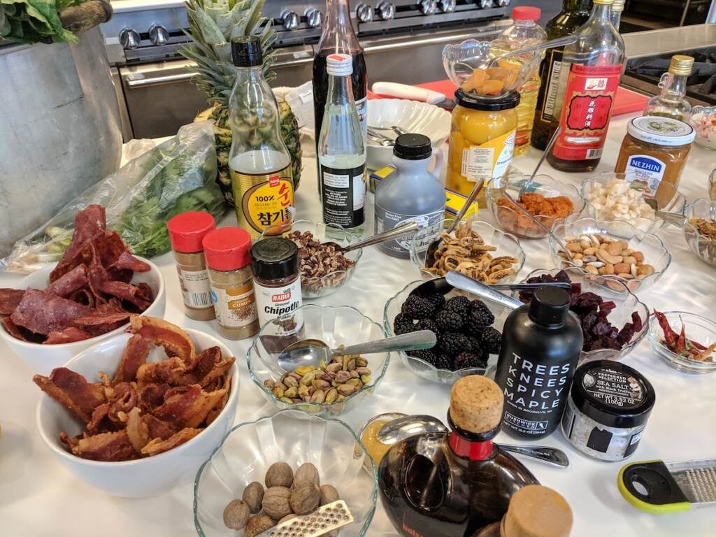 A table full of ingredients to dress Chef Yuhnis Sydnor's baked sweet potatoes. (Photo courtesy of the Culinary Literacy Center)