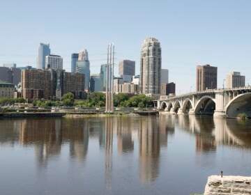 File photo: The Minneapolis skyline is shown Thursday, July 11, 2019, behind the Mississippi River.  (AP Photo/Jim Mone)