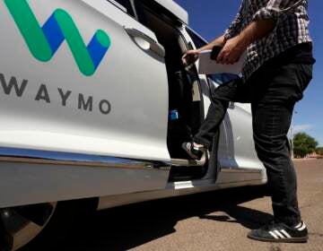 File photo: A Waymo minivan arrives to pick up passengers for an autonomous vehicle ride, in Mesa, Ariz. Waymo, the Google self-driving vehicle spinoff, is moving to expand its autonomous ride-hailing service to San Francisco. (AP Photo/Ross D. Franklin, File)