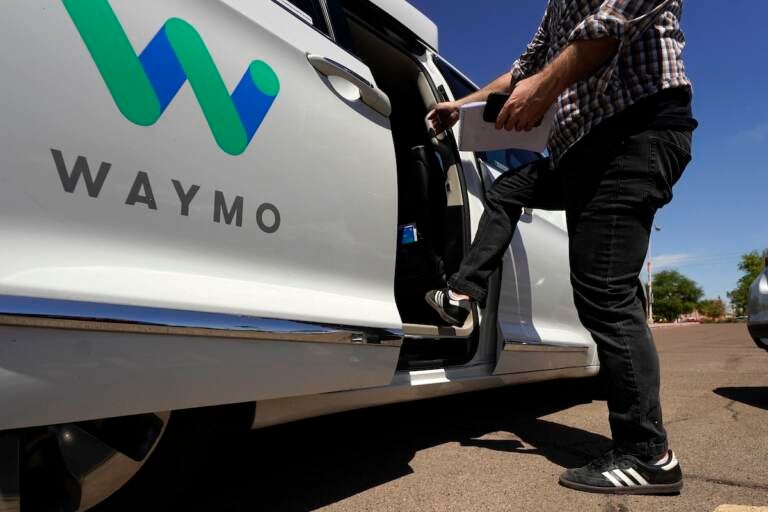 File photo: A Waymo minivan arrives to pick up passengers for an autonomous vehicle ride, in Mesa, Ariz. Waymo, the Google self-driving vehicle spinoff, is moving to expand its autonomous ride-hailing service to San Francisco. (AP Photo/Ross D. Franklin, File)