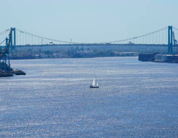 A boat sails on the Delaware River in view of the Walt Whitman Bridge, in Philadelphia, Monday, Sept. 27, 2021