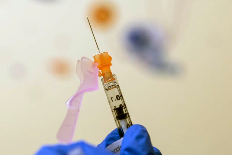 File photo: Nurse Lydia Holly prepares a child's COVID-19 vaccine dose, on Nov. 3, 2021, at Children's National Hospital in Washington. (AP Photo/Carolyn Kaster, File)