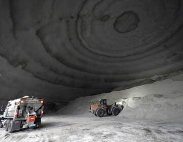 A City of Chicago Department of Streets and Sanitation salt truck waits for a load in a city salt dome in anticipation of a winter storm Tuesday, Feb. 1, 2022, in Chicago. A major winter storm is expected to affect a huge swath of the United States beginning Tuesday, with heavy snow starting in the Rockies and freezing rain as far south as Texas before it drops snow and ice on the Midwest