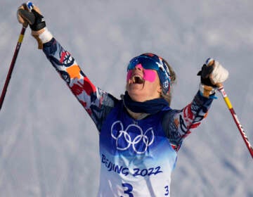 Norway's Therese Johaug celebrates after winning the gold medal during the women's 7.5km + 7.5km Skiathlon cross-country skiing competition at the 2022 Winter Olympics, Saturday, Feb. 5, 2022, in Zhangjiakou, China. (AP Photo/Alessandra Tarantino)