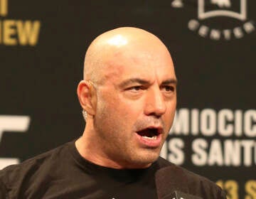 File photo: Joe Rogan is seen during a weigh-in before UFC 211 on Friday, May 12, 2017, in Dallas before UFC 211. Spotify’s popular U.S. podcaster has apologized after a video compilation surfaced that showed him using racial slurs in clips of episodes over a 12-year span. In a video posted on his Instagram account on Saturday, Feb. 5, 2022, Rogan who hosts a podcast called “The Joe Rogan Experience,” said his use of the slurs was the ''most regretful and shameful thing that I’ve ever had to talk about publicly.'' ( AP Photo/Gregory Payan, File)