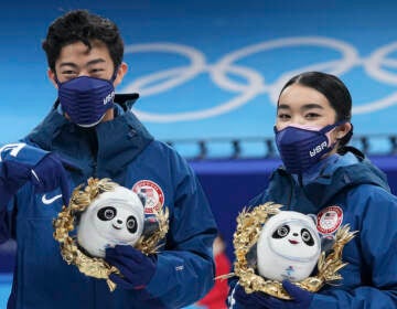 Silver medalists Karen Chen and Nathan Chen pose for a photo after the team event in the figure skating competition at the 2022 Winter Olympics, Monday, Feb. 7, 2022, in Beijing. (AP Photo/David J. Phillip)
