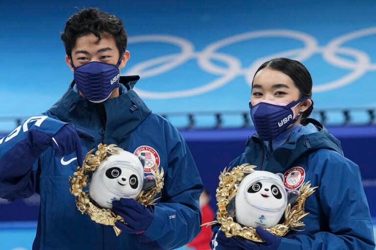 Silver medalists Karen Chen and Nathan Chen pose for a photo after the team event in the figure skating competition at the 2022 Winter Olympics, Monday, Feb. 7, 2022, in Beijing. (AP Photo/David J. Phillip)