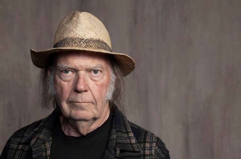 FILE - Neil Young poses for a portrait at Lost Planet Editorial in Santa Monica, Calif. on Sept. 9, 2019.  Young isn't satisfied with urging his fellow musicians to join him in taking their music off the streaming service Spotify. Now he wants company employees to quit their jobs before it “eats up your soul.
